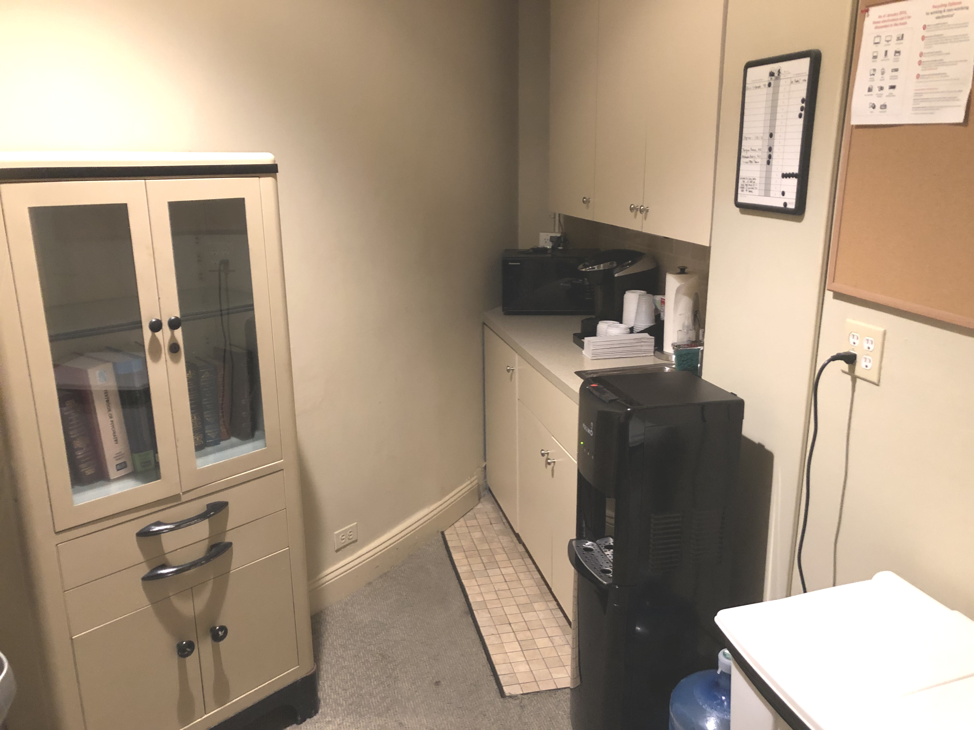 Clinic office featuring a microwave and monitor setup